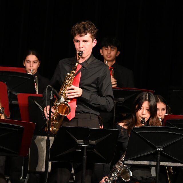 Aragon held their spring jazz concert on April 11 at 7 p.m. in the theater with the Jazz Band and Jazz Ensemble.

The groups performed a total of ten different pieces, including songs such as “I Snore, You Drive!” by Victor Lopez and “Every Summer Night” by Pat Metheny. Additionally, the Jazz Ensemble premiered a new piece, “Simpler Times” by Jay Jordan.

“I got to do a fun drum beat when our flute player was soloing, called the Cascara Drum Beat,” said senior Jazz Band drummer Natasha Efron. “I had never played it before, and I hadn’t practiced it before … so it was really fun for me to learn and experiment with the sound.”

Following intermission, band director Kevin Gallagher announced awards for student performers. 

“One thing I really like about the awards that Mr. Gallagher does is that they’re all student-chosen,” said senior Jazz Ensemble alto saxophonist Dominic Kudzia. “So it feels especially cool when your peers recognize you [for something], instead of just the director recognizing you for it.”

Following the awards for Jazz Ensemble, the senior players gave Gallagher a farewell gift. The gift consisted of a travel bag for the upcoming music program trip to Ireland, a wallet, a book of tips that the seniors have been gathering from Gallagher since the start of 2024 and other various items. 

“The concert was very well-produced and performed,” said freshman Rosie Mayor. “[The senior gift] was a really sweet way for [students] to honor their teacher.”

Overall, the consensus amongst performers was that the concert turned out well.

“We did pretty good,” Efron said. “We played everything like we were supposed to, and there were only a couple of small, unnoticeable, little mistakes within the band.”

Audience members also enjoyed the concert. 

“[The concert] was really nice,” said sophomore Prerna Gopinath. “The trombone solos were really good and the Jazz Band played really well.”

Aragon Music’s spring concert series will continue every week for the next month, with the orchestra performance up next on April 18 at 7 p.m. in the theater.

Reporting by Reika Lam.